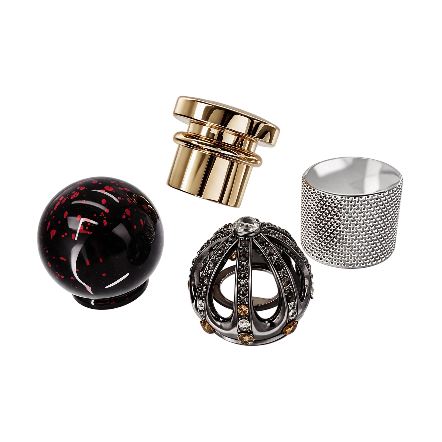 Four custom perfume caps with distinct shapes, textures and decorative finishes