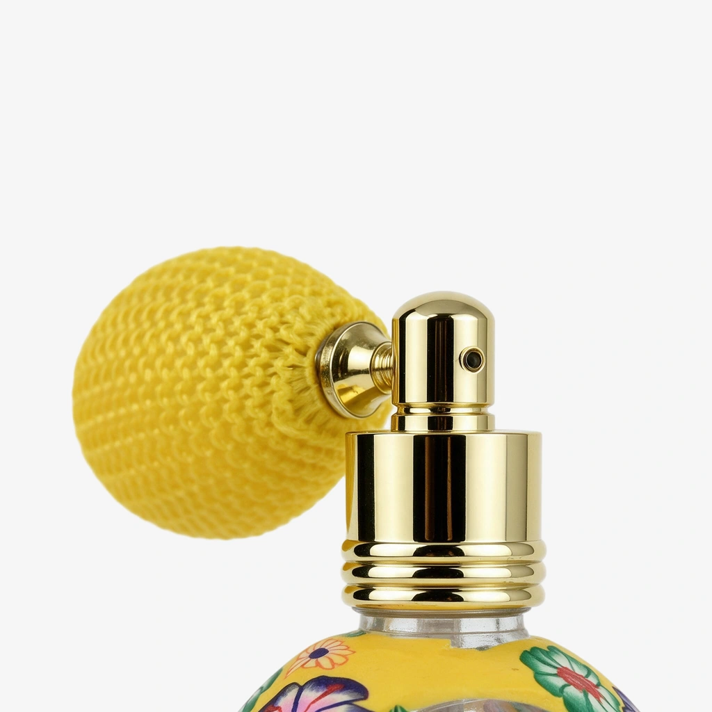 Gold bulb atomizer details with a yellow woven bulb