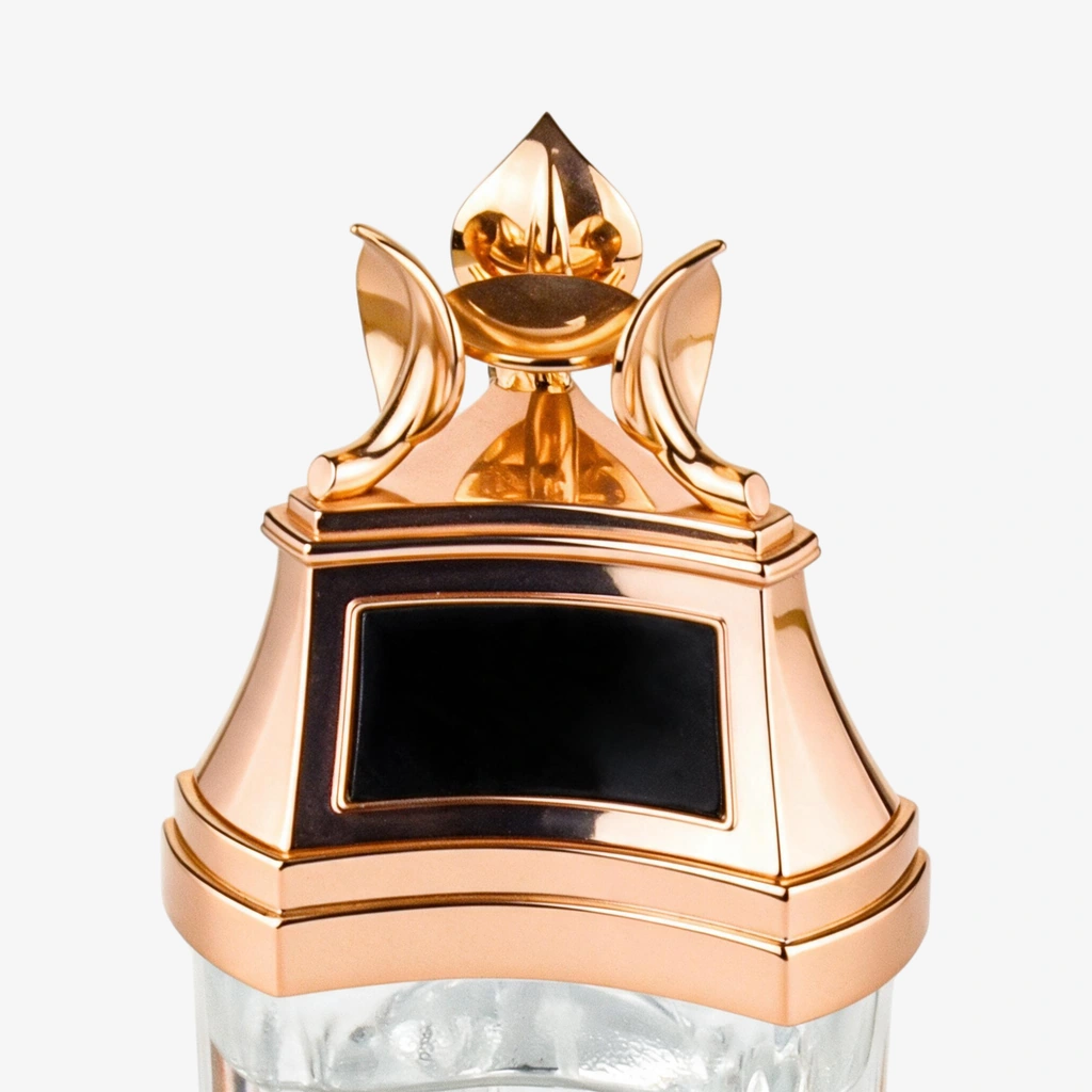 Gold decorative cap and shoulder cover above a short glass bottle section