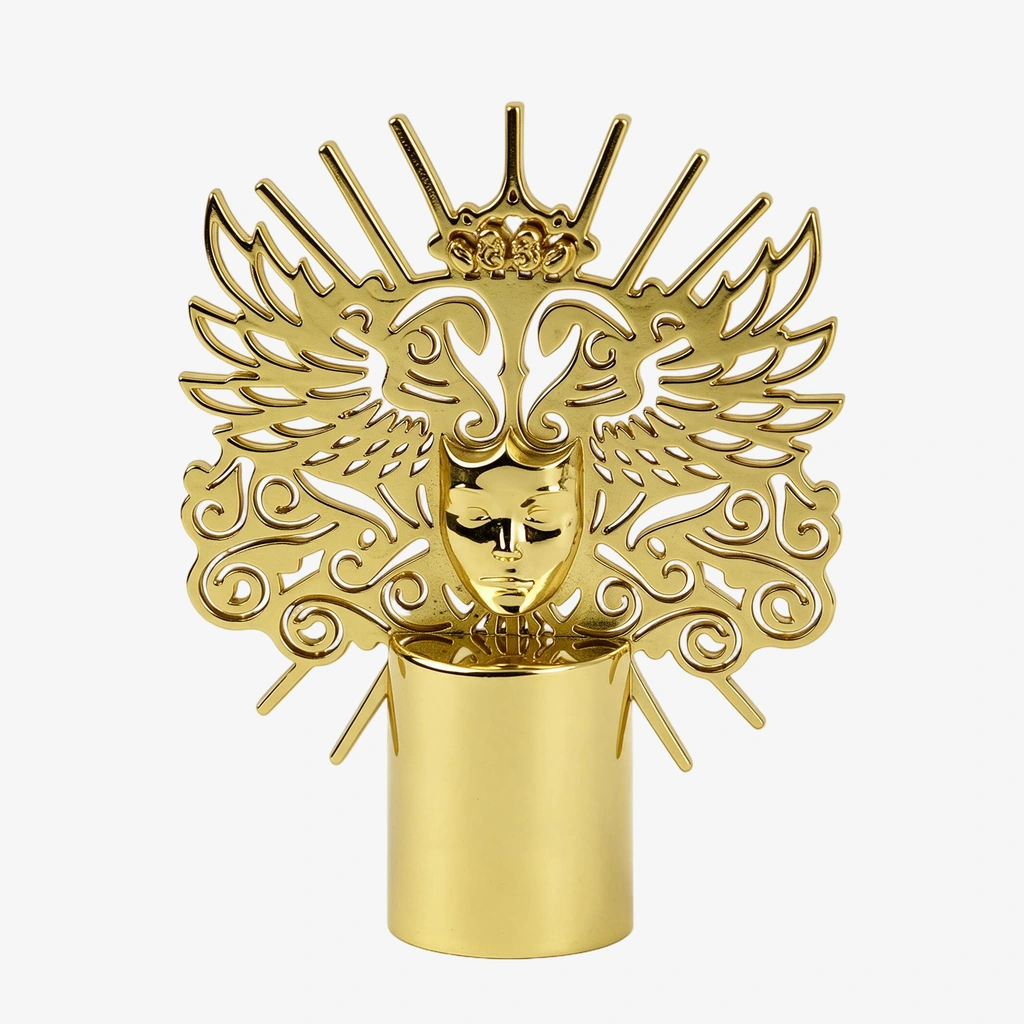Gold openwork perfume cap with sculpted decorative motifs